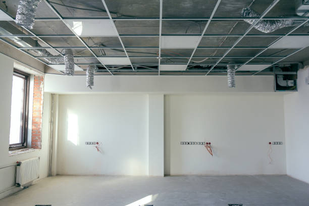 istock The hanging ceiling in the office under construction. The ceiling false system. Suspended ceiling frame and board under construction at the construction site. 1316369347