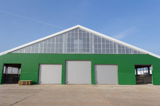 istock Building under construction with sandwich panel of insulation on the wall. Construction of a new industrial building. 1316369355