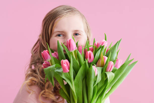 istock modern child with long wavy blond hair on pink 1316370300