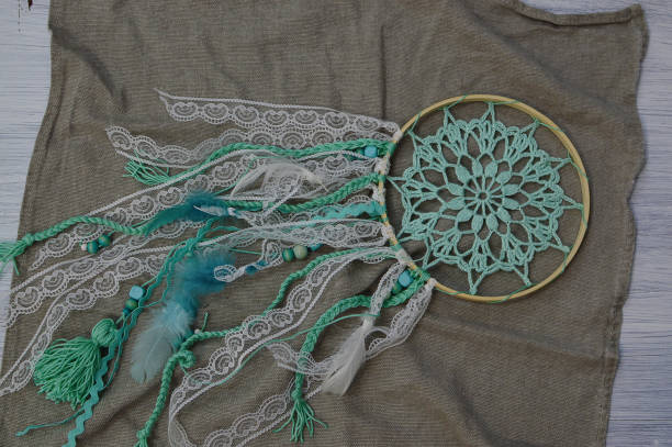 istock Mint in dream catcher color on natural linen fabric, hand made. 1316374072