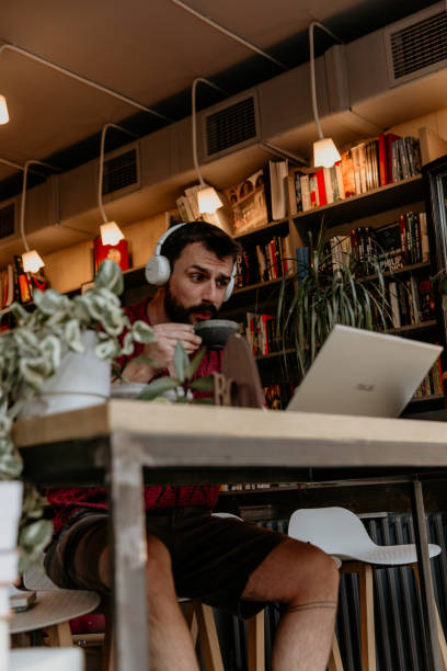 istock Urban man with a headphones drinking coffee 1316374790