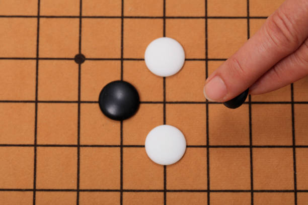 istock chinese game go,  Gobang and go game board 1316375826