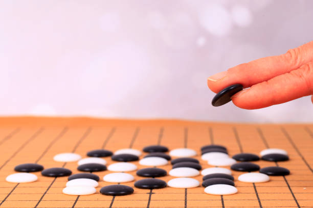 istock chinese game go,  Gobang and go game board 1316375827