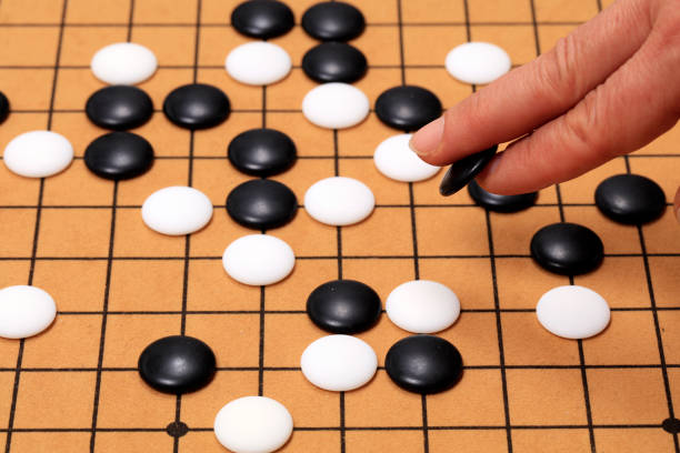 istock chinese game go,  Gobang and go game board 1316375829