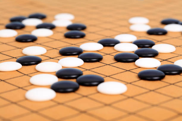istock chinese game go,  Gobang and go game board 1316375870