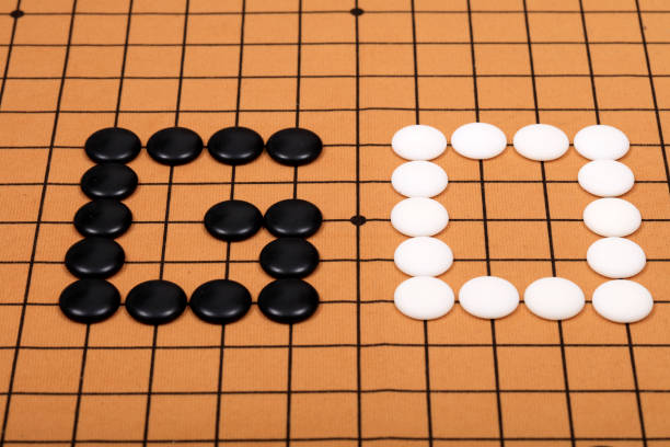 istock chinese game go,  Gobang and go game board 1316375884