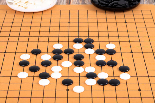 istock chinese game go,  Gobang and go game board 1316376414