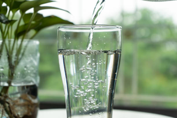 istock Pouring water into a glass 1316378800