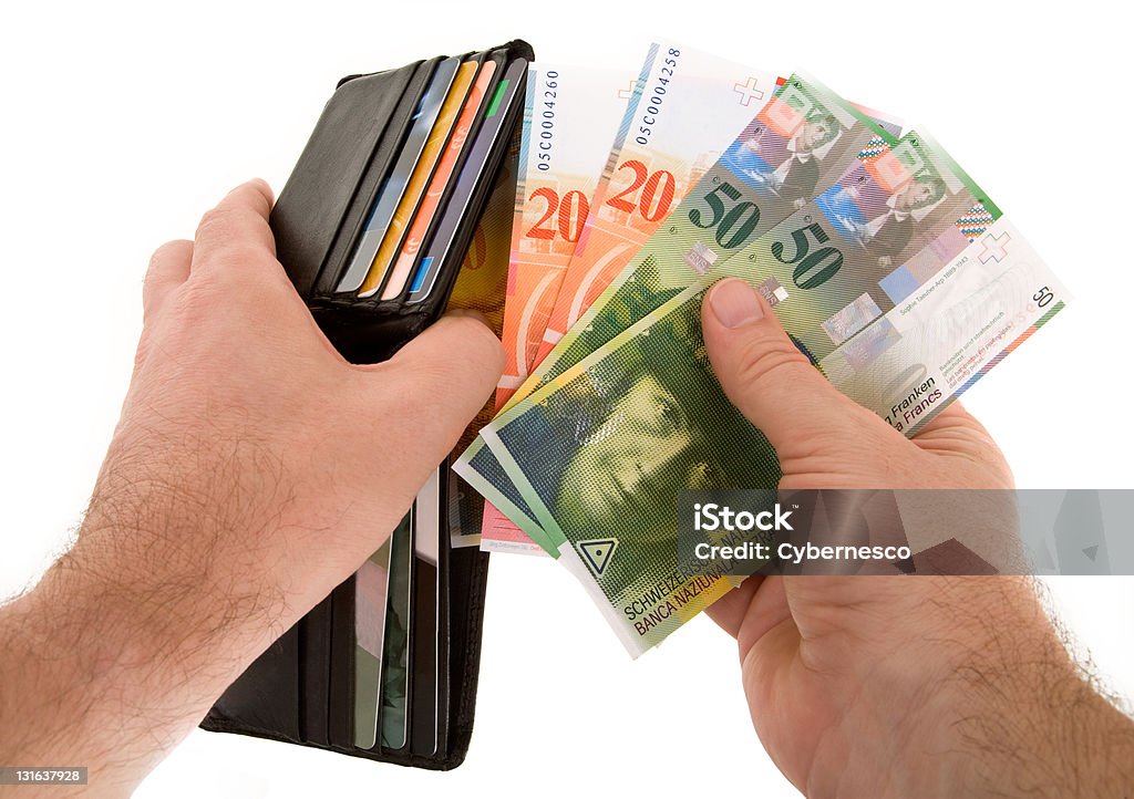 Pago en efectivo con moneda de franco suizo - Foto de stock de Cartera libre de derechos