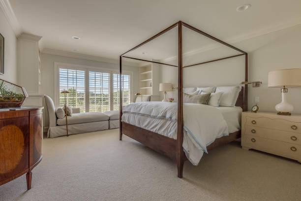 istock Canopy bed with white duvet and bedding 1316380323