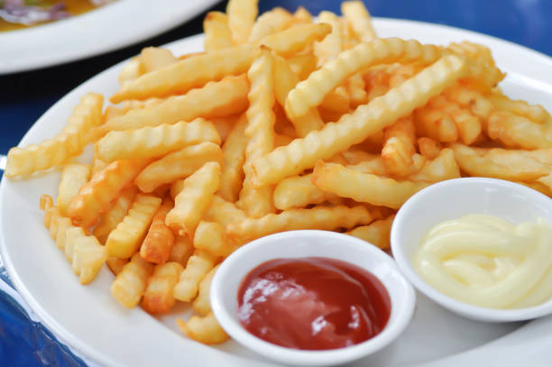 French fries or fried potato with tomato sauce or catchup stock photo