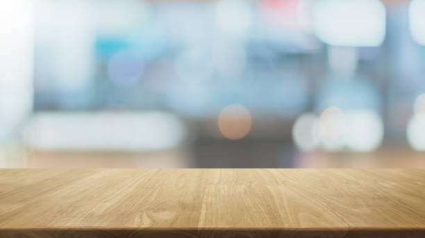istock Empty wood table top and blurred coffee shop and restaurant interior background - can used for display or montage your products. 1316382004