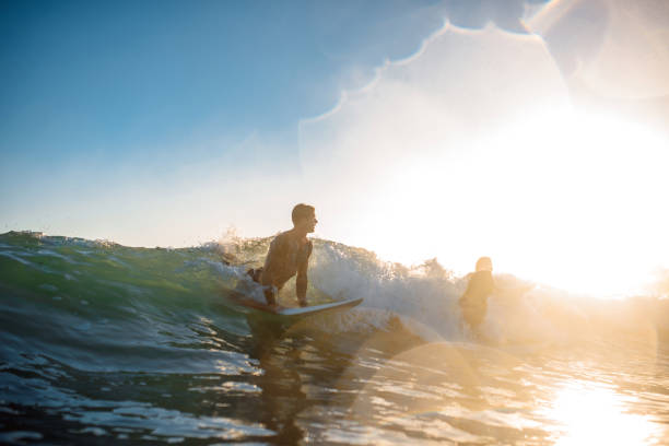 istock Gold Coast Surfers Catching a Wave at Sunrise 1316390022