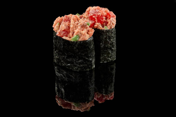 istock Gunkan maki sushi with eel and avocado on black background 1316390122