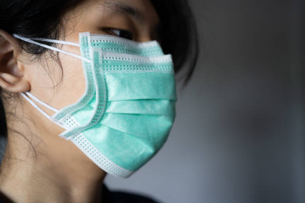 istock A man wearing two disposable masks 1316392299