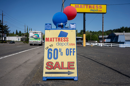 Tigard, OR, USA - May 4, 2021: Sale promotion signicade is seen outside the Mattress Depot USA store in Tigard, Oregon.