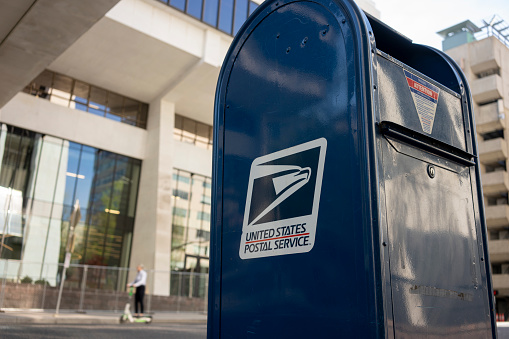 Portland, OR, USA - Apr 18, 2021: Closeup of a USPS mailbox in downtown Portland, Oregon.