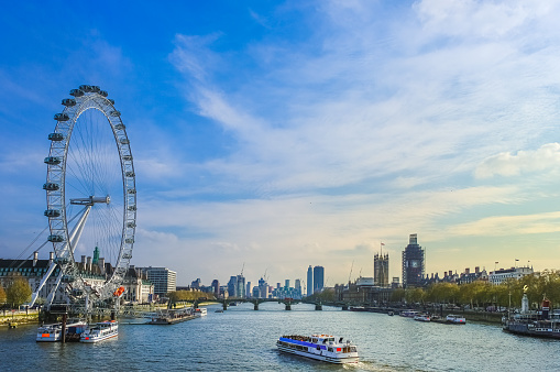 View of downtown London, England, along River Thames on nice spring day; view from the bridge