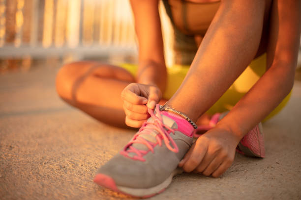 istock Sportswoman Tying Shoelaces. 1316395272