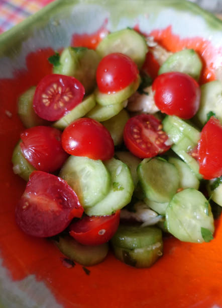 istock Seasoned salad with cherry tomatoes and cucumber 1316395444
