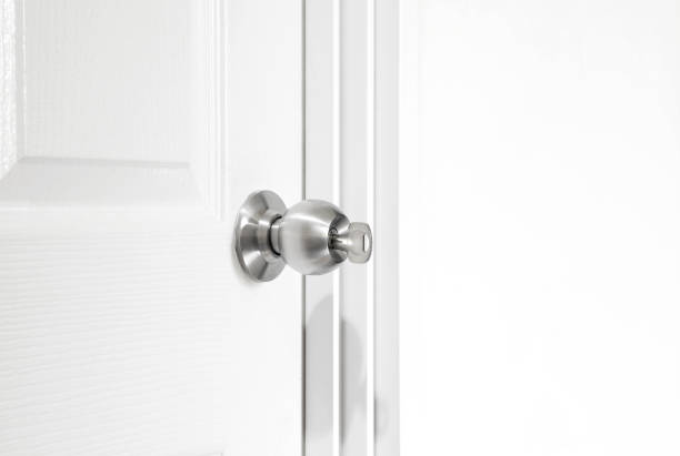 istock Installing locking knob with key at the door inside the house 1316396421