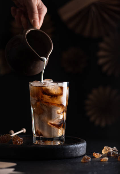 istock Milk clouds in a glass with coffee. 1316398619