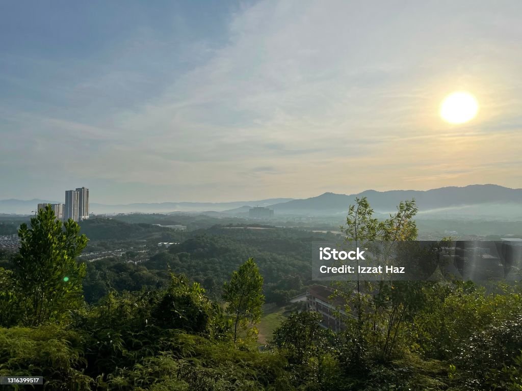 A scene one morning at the top of a hill showing the sun rising Aerial View Stock Photo