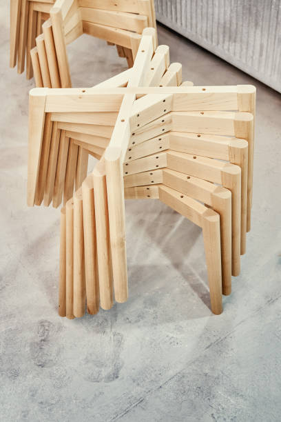 istock Wooden bases with legs for chairs assembling in paint booth 1316401207