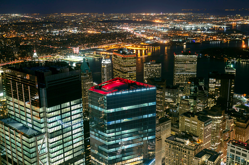 New York City, Lower Manhattan at night and East River, aerial view.