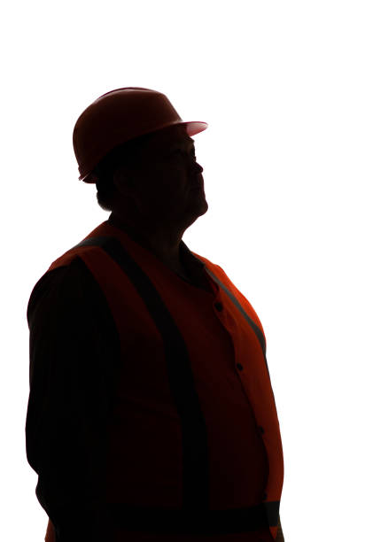 istock silhouette profile of contruction worker in hard hat looking up on white isolated background, building industry concept 1316403398