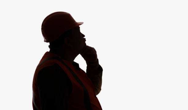 istock funny silhouette profileof thinking contruction worker in hard hat on white isolated background, building industry concept 1316403404