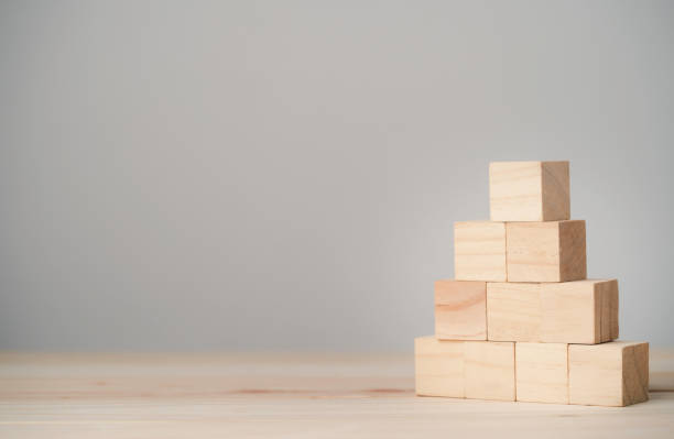 istock Stacking blank wooden cubes on table with copy space for input wording and infographic icon. 1316403711