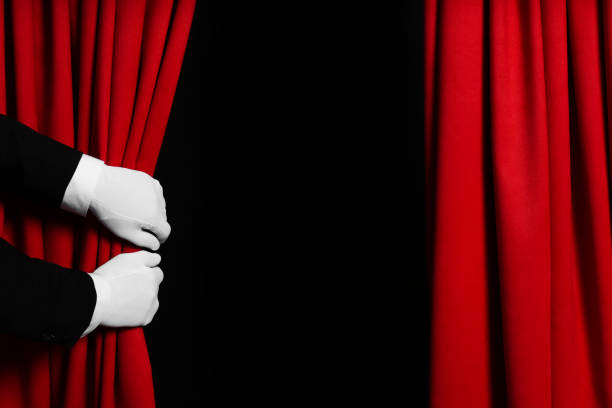 istock Person opening red front curtains on black background, closeup. Space for text 1316403934