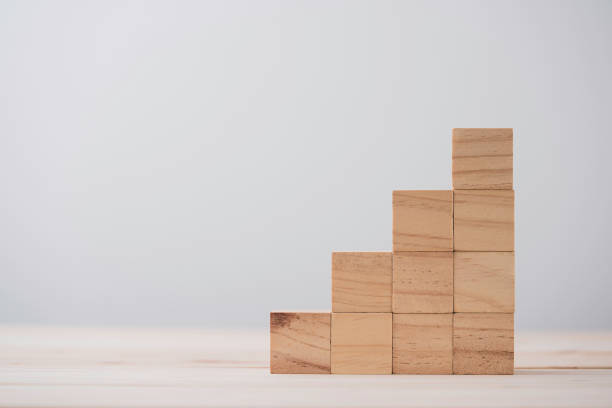 istock stacking blank wooden cubes on table with copy space for input wording and infographic icon. 1316403989