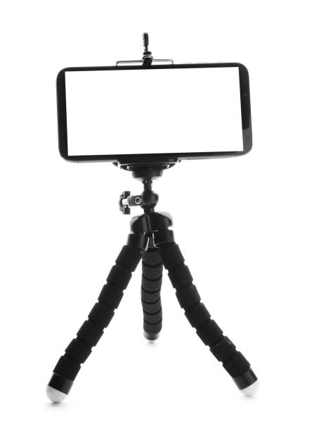 istock Modern tripod with smartphone isolated on white 1316405063