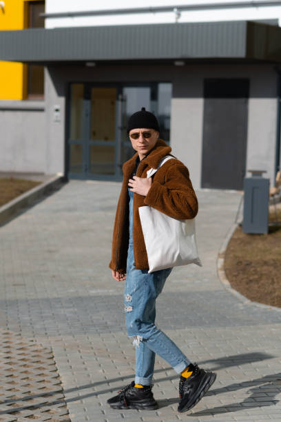 istock Hipster goes to the store with a reusable bag 1316405373