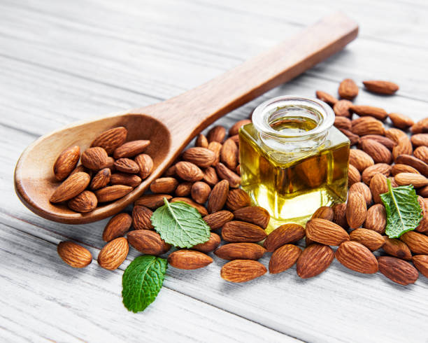istock Almond oil and  almonds 1316406626
