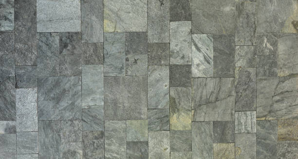 istock background gray wall of rough stone blocks 1316407359