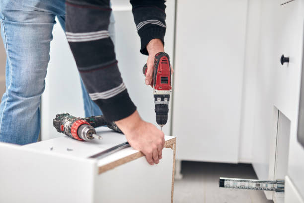 istock Handyman worker assembling furniture and fixing it. 1316408821