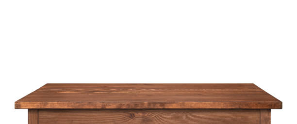 istock Wooden table or tabletop isolated on white. Dark brown table as template for ideas, high resolution long picture. 1316408887