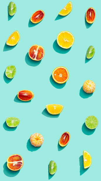 istock Colorful fruit pattern from fresh citrus, lemon, red orange, tangerine and lime on blue background. Summer food. 1316409158