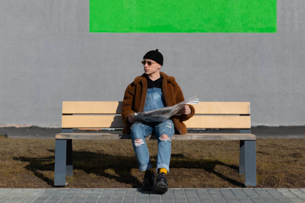 istock A man reading a newspaper on a sunny day. 1316411117