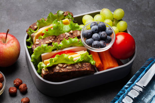 istock Healthy school lunch box with sandwich and fresh vegetables 1316413435