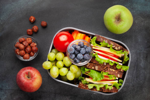 istock Healthy school lunch box with sandwich and fresh vegetables 1316413983