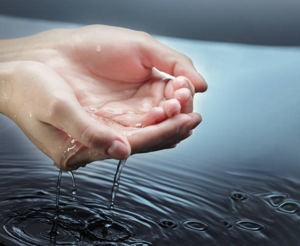 istock Woman Holding water in cupped hands 1316414449