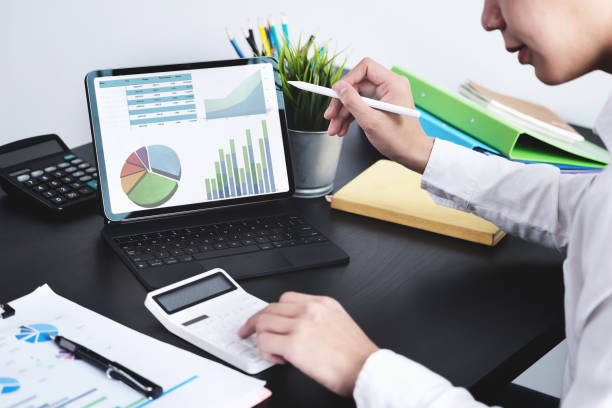 istock The young businessman  using tablet computer and calculators  to check financial statements at home instead of working in the office 1316415563