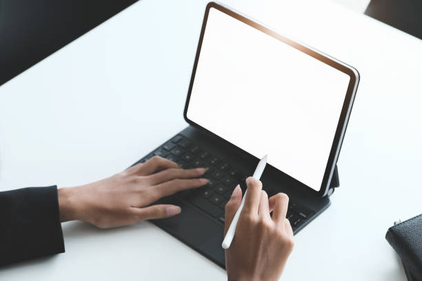 istock Business Women use a tablet for work, a blank tablet screen can add text or other media. 1316415900