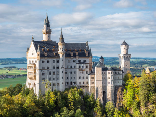 Schwangau, Bavaria, Germany 11/10/2024 view of the Neuschwanstein Castle, 19th-century romantic architecture historicist palace on a rugged hill of the foothills of the Alps.