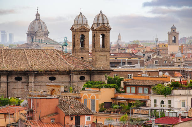 istock Panoramic view to Rome rooftops with catholic basilics and monuments, Italy 1316418295