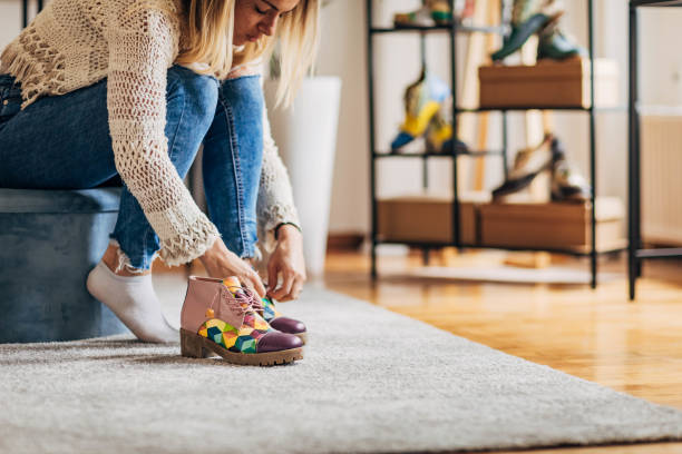 istock Woman trying on shoes 1316418406